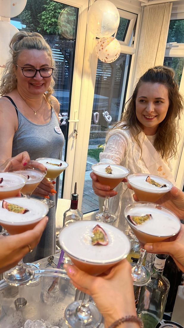 Two hens toasting their espresso martinis